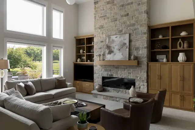 Lakeville great room remodel with floor-to-ceiling stone fireplace and white oak built-in shelving